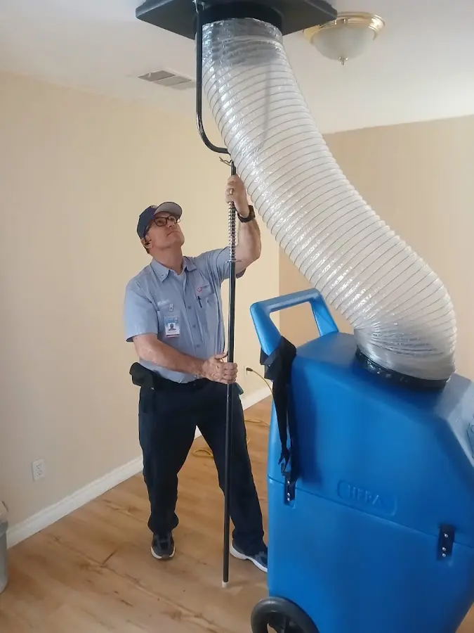 Furnace Tune-Up technician using HEPA equipment in Knoxville
